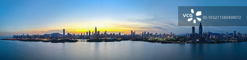 航拍深圳湾海边日落海岸线城市天际线图片素材
