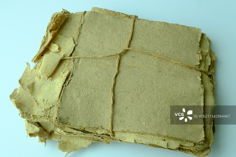 老式黄色纯手工草纸特写。高清纸张背景素材背景图图片素材