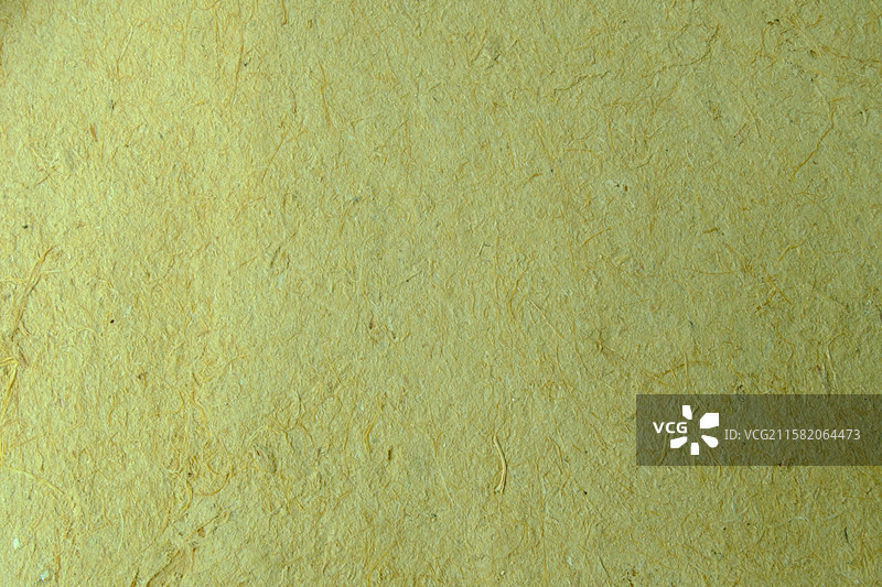 老式黄色纯手工草纸特写。高清纸张背景素材背景图图片素材