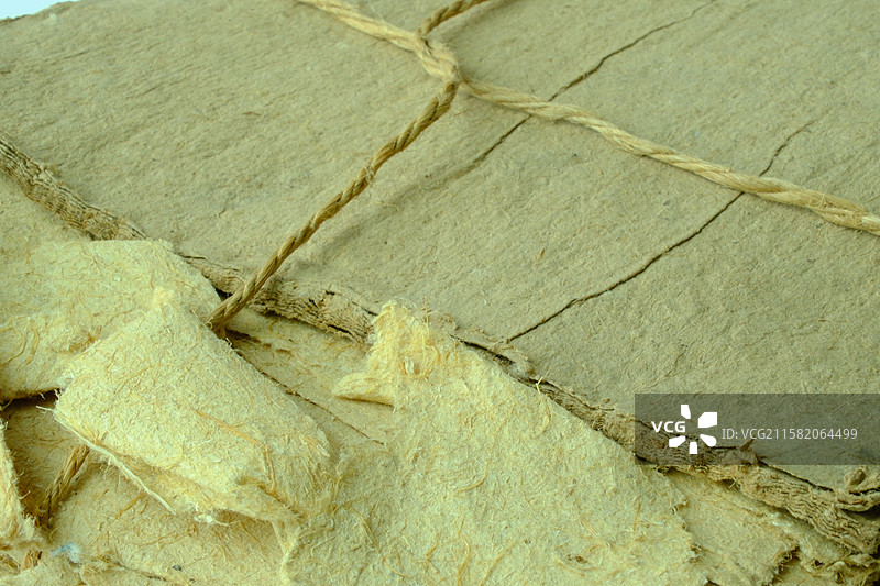 老式黄色纯手工草纸特写。高清纸张背景素材背景图图片素材