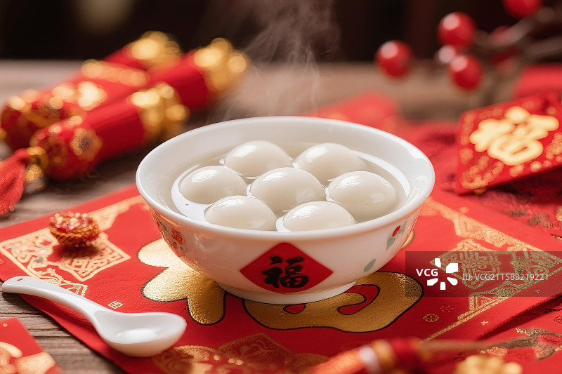 元宵节 春节装饰的喜庆桌子上 摆放着一碗汤圆 灯笼 红包 过年图片素材