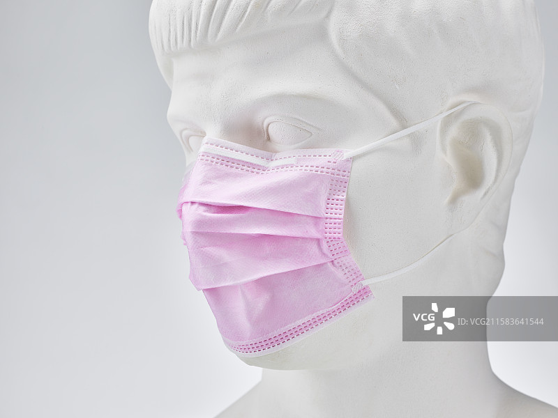 戴口罩的罗马青年石膏像图片素材