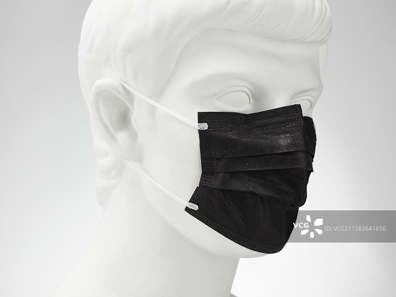 戴口罩的罗马青年石膏像图片素材