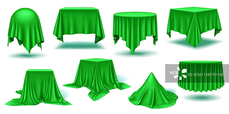 光滑优雅的绿色丝绸垂挂在桌子上图片素材