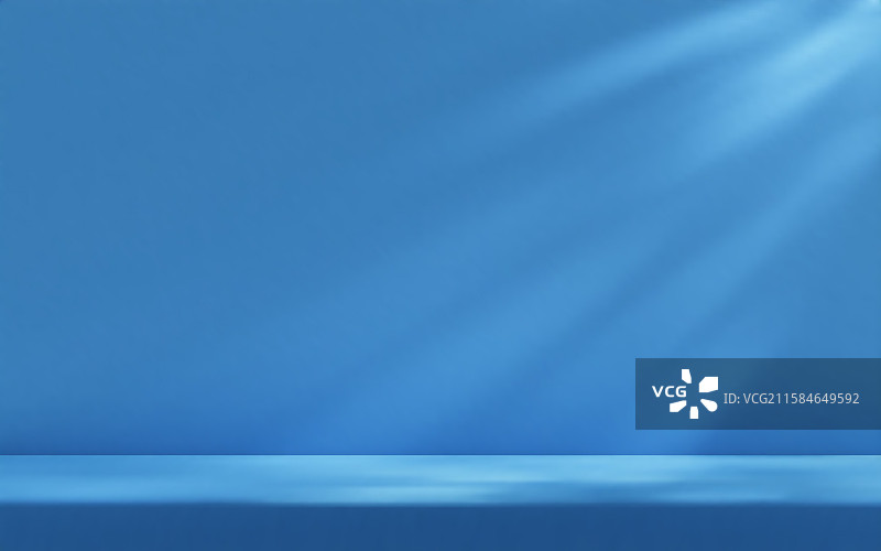 阳光照射下的蓝色工作室墙壁图片素材