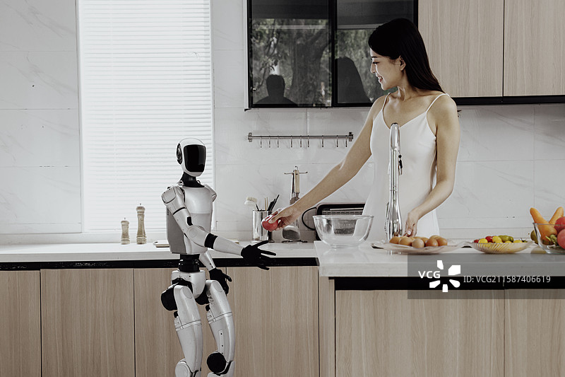 机器人在厨房人机互动图片素材