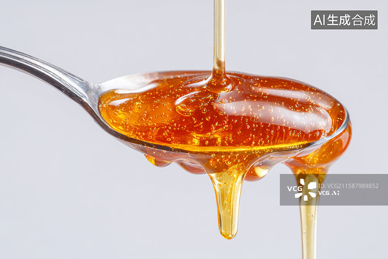 【AI数字艺术】勺子里流淌的金黄蜂蜜图片素材