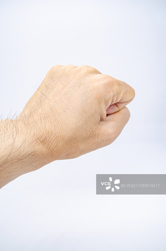 中国人体特征拍摄主题，黄种人的手掌手指手背手心，攥起来的拳头，数字十手势特写，室内图像摄影图片素材