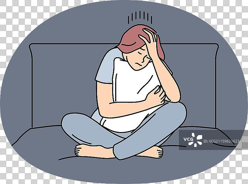 忧郁的女人伤心地坐在床上图片素材