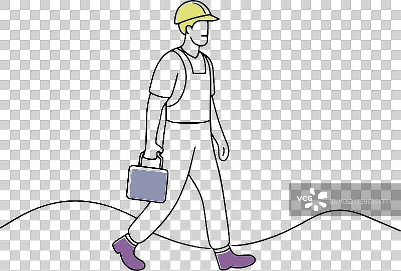 一个建筑工人走在土路上图片素材