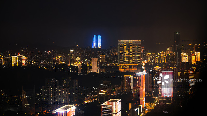 厦门思明区夜景航拍飞机航拍城市夜景俯瞰蓝色双子塔暖黄灯光车流光带现代璀璨图片素材