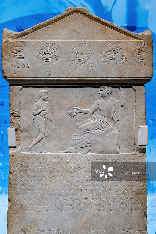 希腊碑铭博物馆藏带浮雕装饰的大理石石碑图片素材