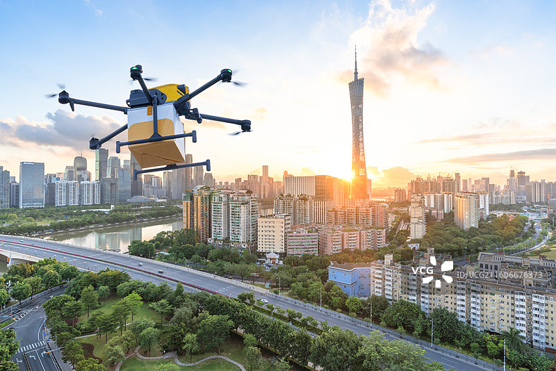 广州CBD城市地标建筑和无人机送货，无人机送餐，低空经济和新质生产力概念图片素材