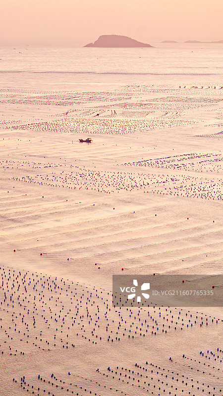 航拍竖画幅夕阳下大海海洋海产养殖基地自然风光图片素材