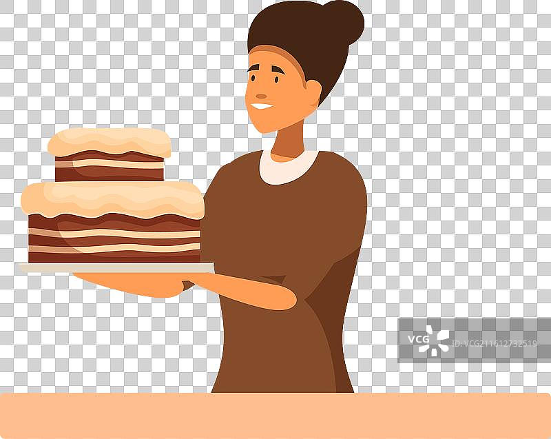 糕点师手持一块带有糖霜的巧克力蛋糕图片素材