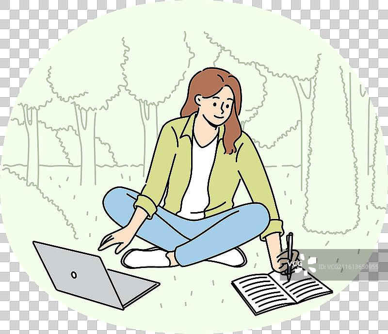 女学生坐在草坪上做笔记图片素材