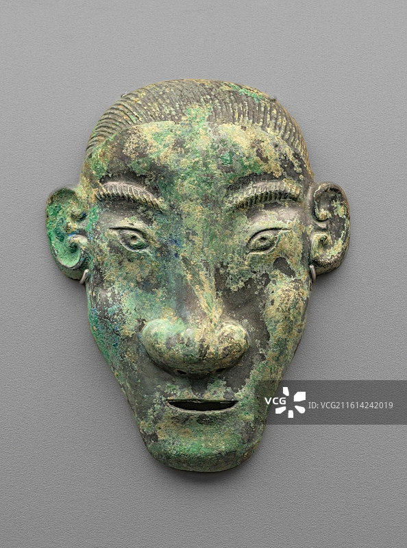 铜人面饰_西周_滕州市博物馆_苏州博物馆_铸河山_中国青铜时代的兵器展图片素材
