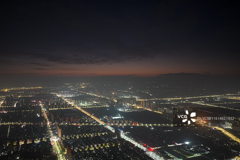 高视角周口川汇区城市西侧凌晨日出城市天际图片素材