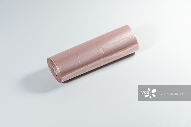 粉色卷装垃圾袋 家用厨房一次性清洁袋图片素材