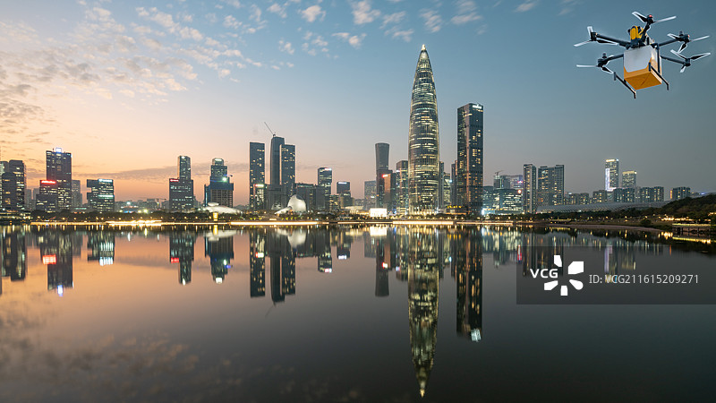深圳市深圳人才公园夜景城市建筑和送货送餐的无人机图片素材
