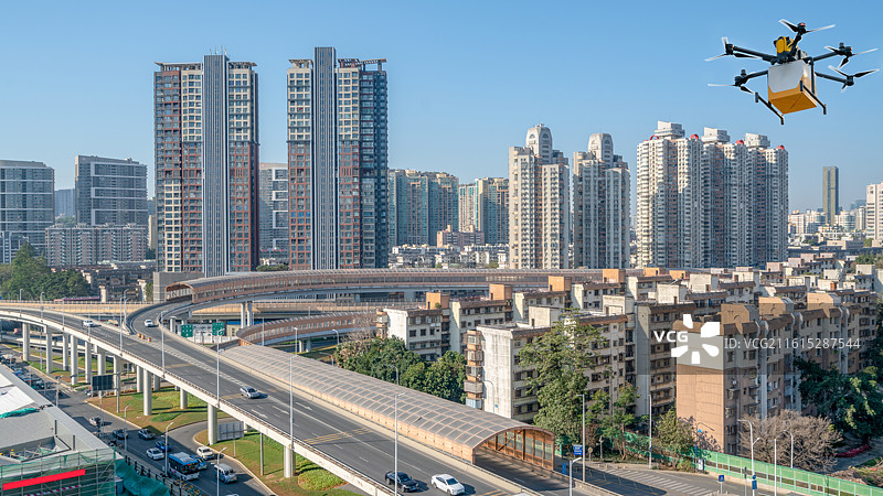 深圳市罗湖区城市建筑和送货送餐的无人机图片素材