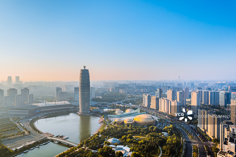 中国河南郑州郑东新区绿地千玺广场CBD和河南艺术中心清晨航拍图片素材