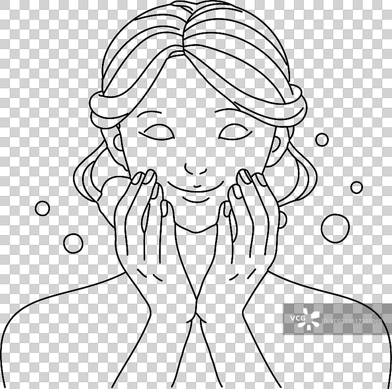 一位漂亮的女士正在用肥皂轻轻地洗脸图片素材