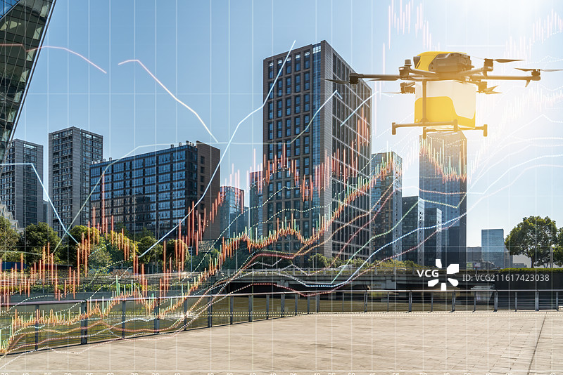 无人机交付与城市景观和财务图表图片素材
