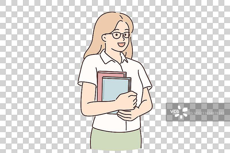 年轻的女学生手中拿着书本站着图片素材