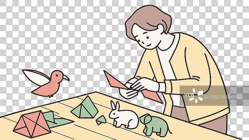 一个人正在制作折纸艺术鸟图片素材