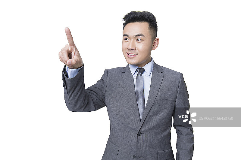 年轻商务男士用手指点触摸屏图片素材