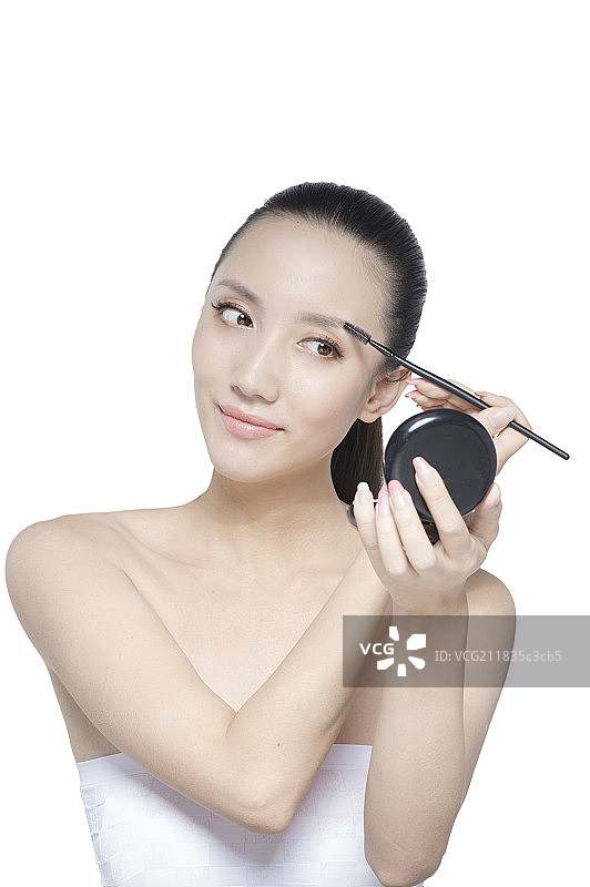 正在化妆的女士图片素材