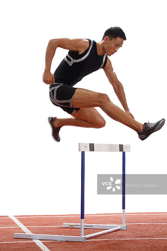 田径运动员做跨栏运动图片素材