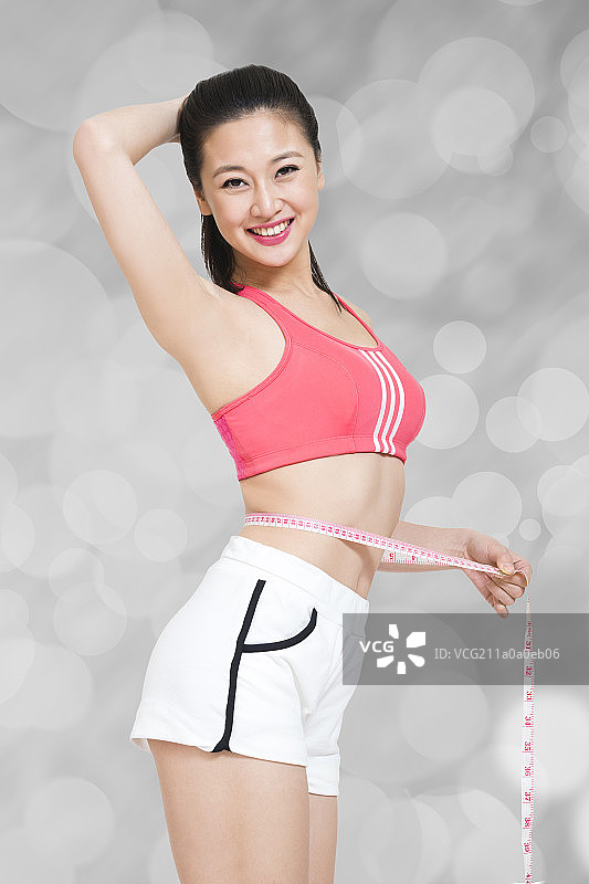 棚拍年轻女人健身塑型图片素材