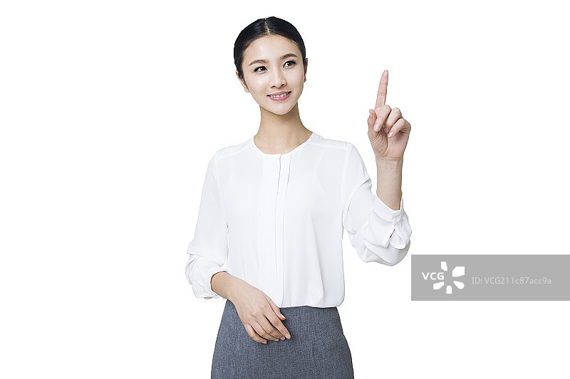 年轻女子用手指点触摸屏图片素材