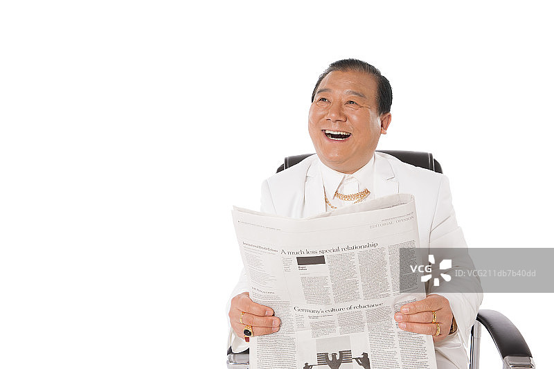 成功男人看报纸图片素材