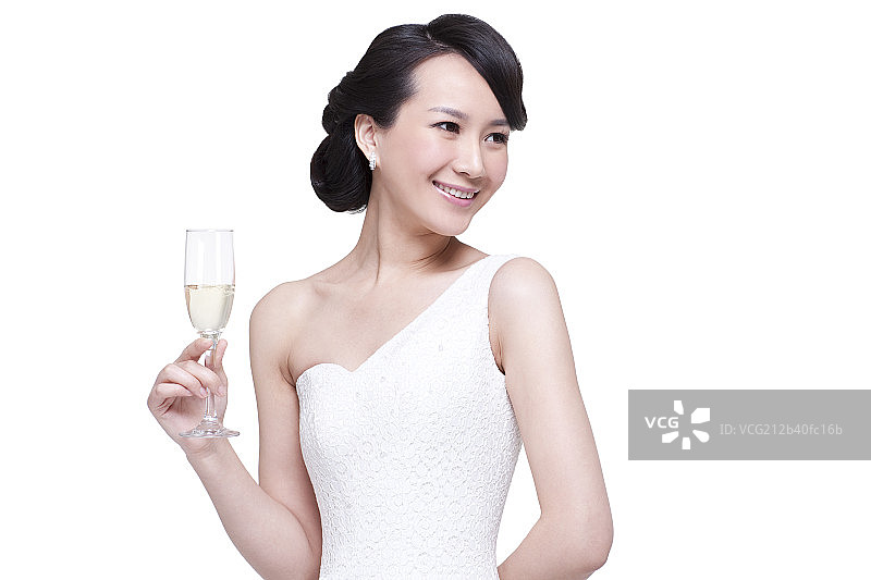 优雅的女人手拿香槟酒杯图片素材
