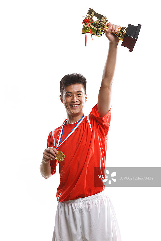 运动员高举奖杯图片素材