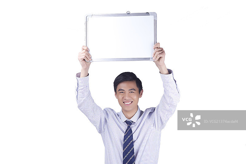 一个拿着白板的商务男青年图片素材