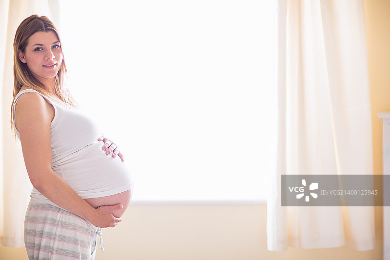 孕妇手扶孕肚图片素材