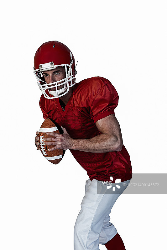 球员手持橄榄球图片素材