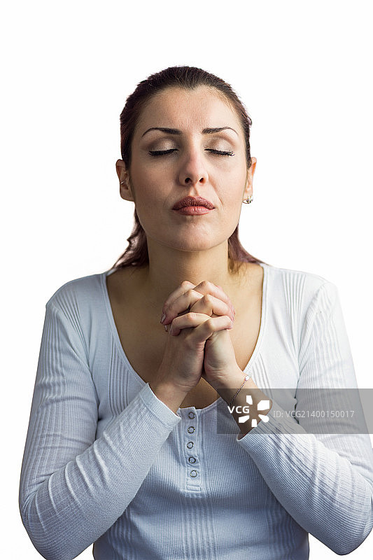 怀着喜悦祈祷的漂亮女人图片素材