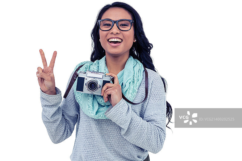 手持数码相机的亚洲女性图片素材