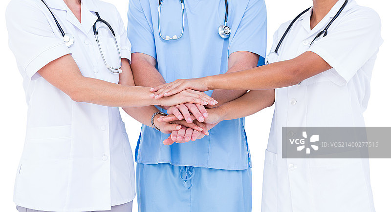 医生和护士在白色背景上将手放在一起图片素材