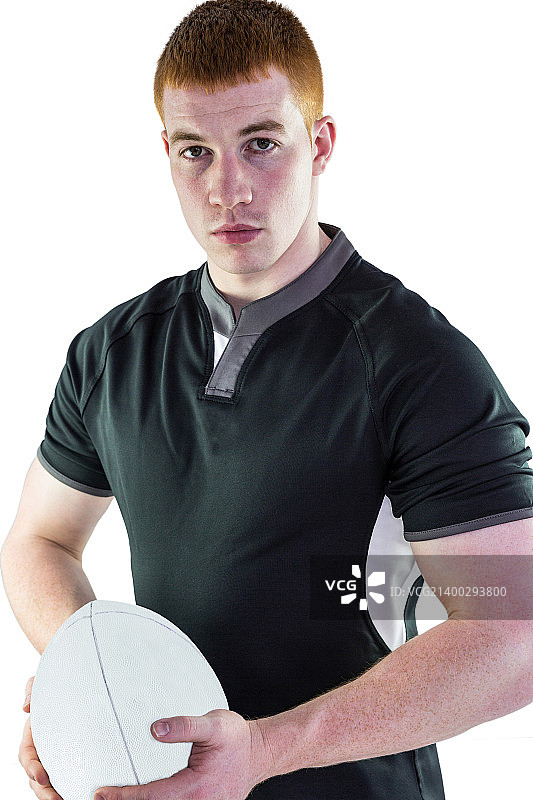 手持橄榄球的严肃橄榄球运动员 портрет图片素材