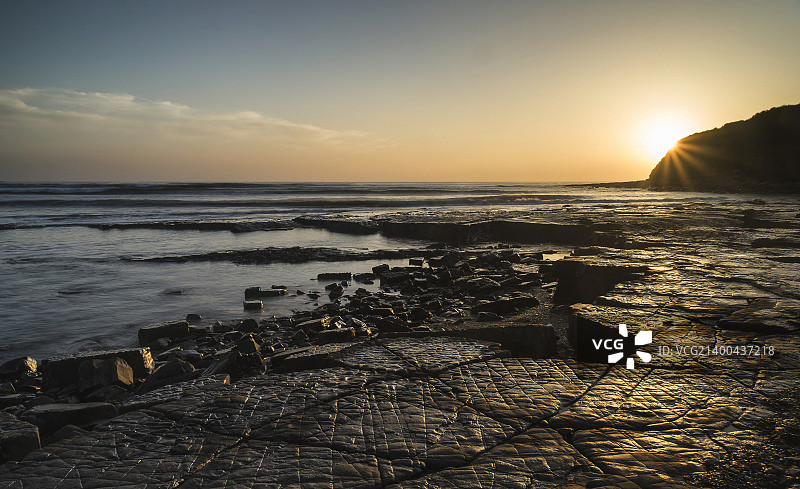 英格兰侏罗纪海岸金默里奇湾的日落美景图片素材