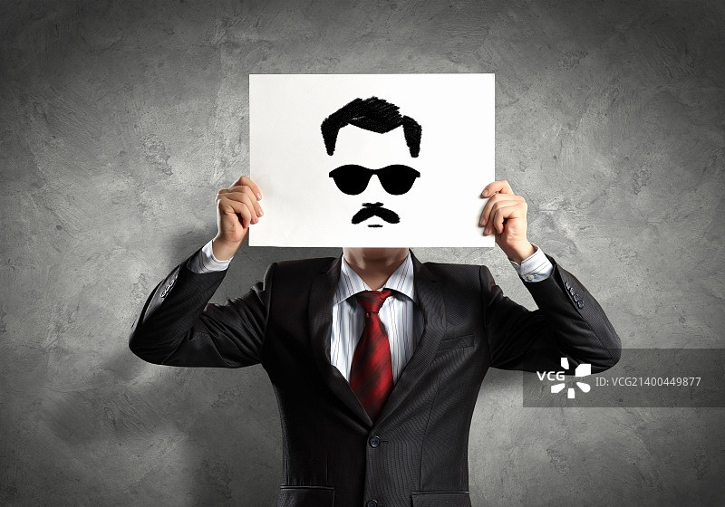 商人手持绘画遮面概念图片图片素材