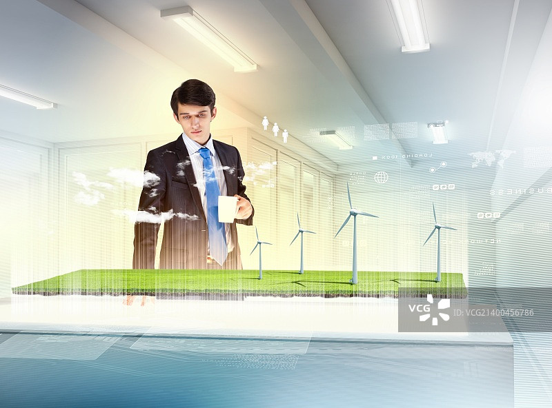 年轻商人观看高科技风车图片图片素材