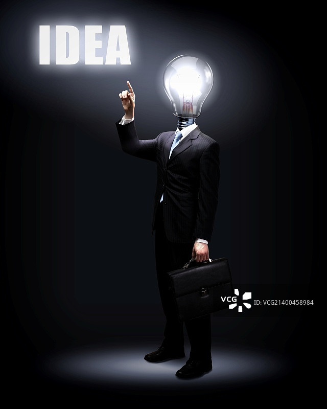 灯泡与商务人士，商业创意象征图片素材