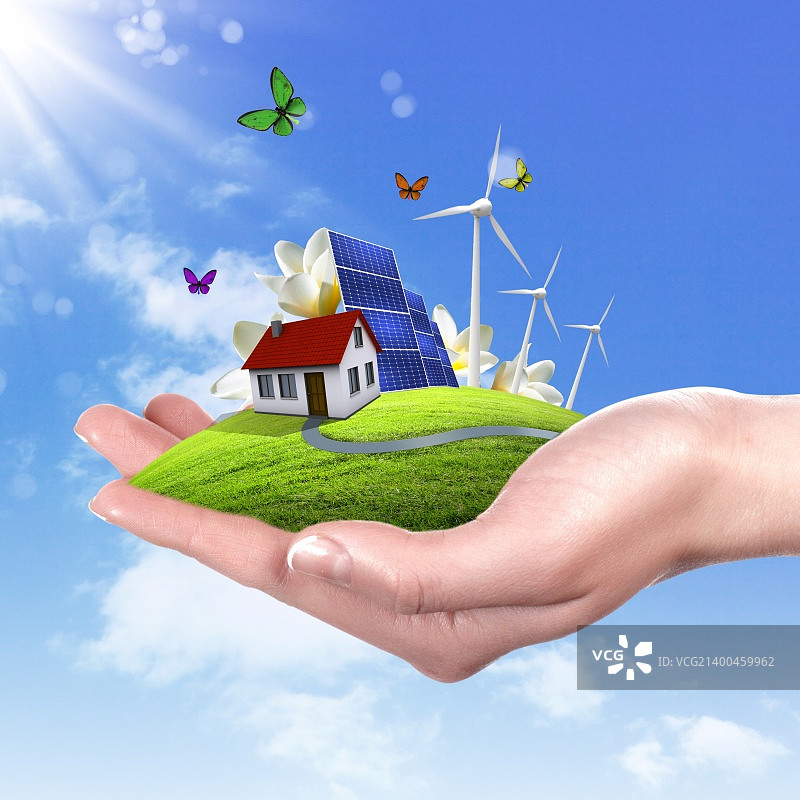 手持带有太阳能电池板的绿色地球图片素材